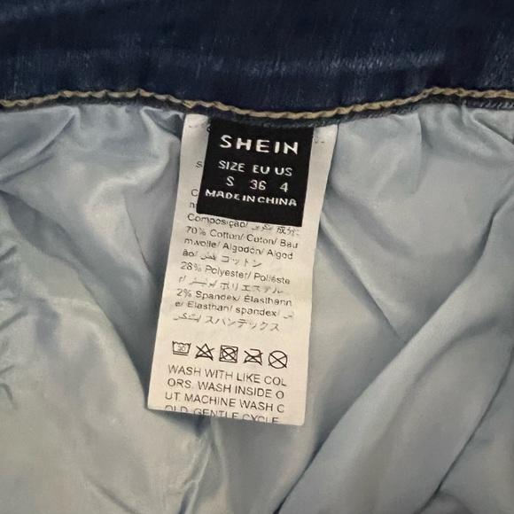 SHEIN Essnce Ripped Raw Trim Denim Shorts in Medium Wash - Picture 3 of 11